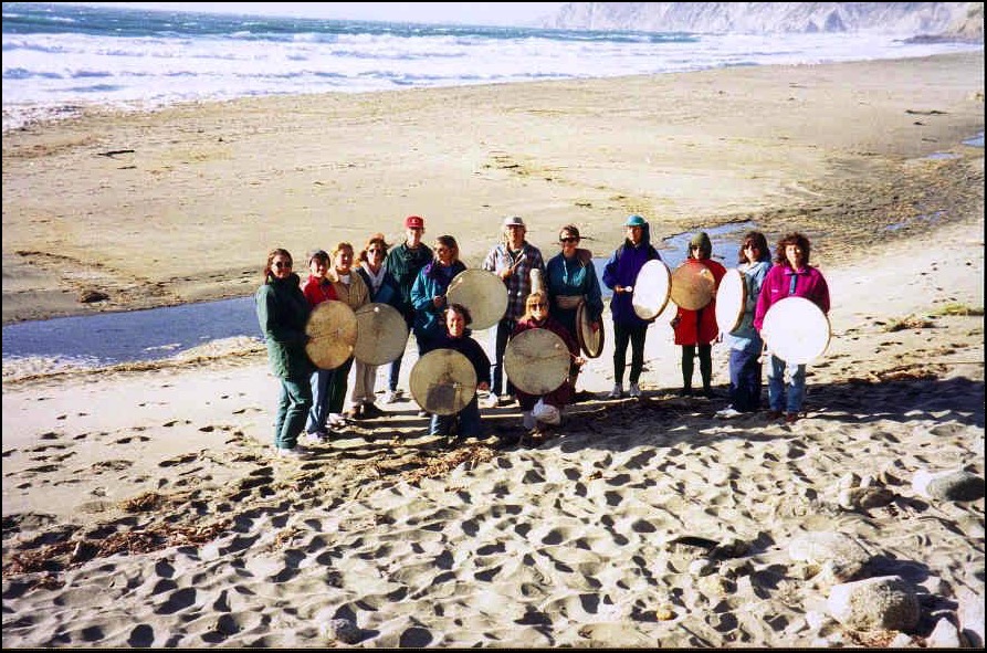 Group with drums on beach
